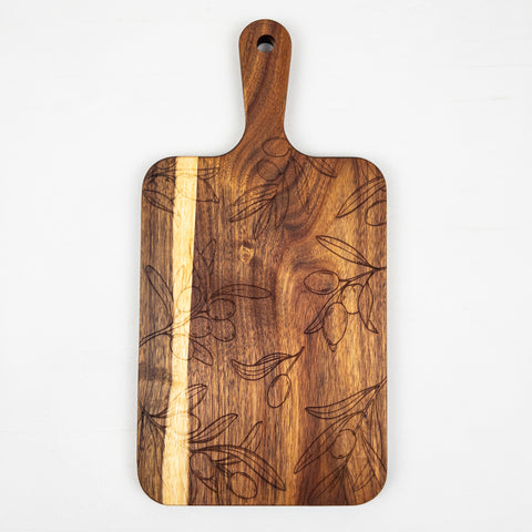 Acacia wood cutting board featuring a precisely laser-engraved olive branch and olive fruit pattern across the surface, ideal for kitchen use or serving.