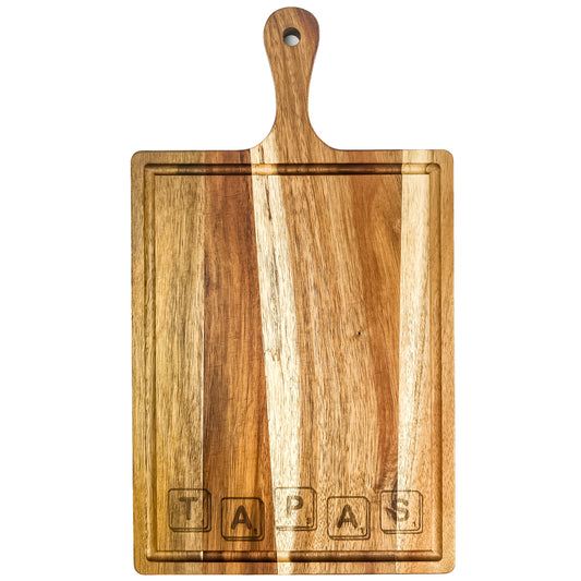 Wooden cutting board with a handle on a white background, featuring the brand 'TapaS'. Acacia wood laser engraved serving board handmade in Spain