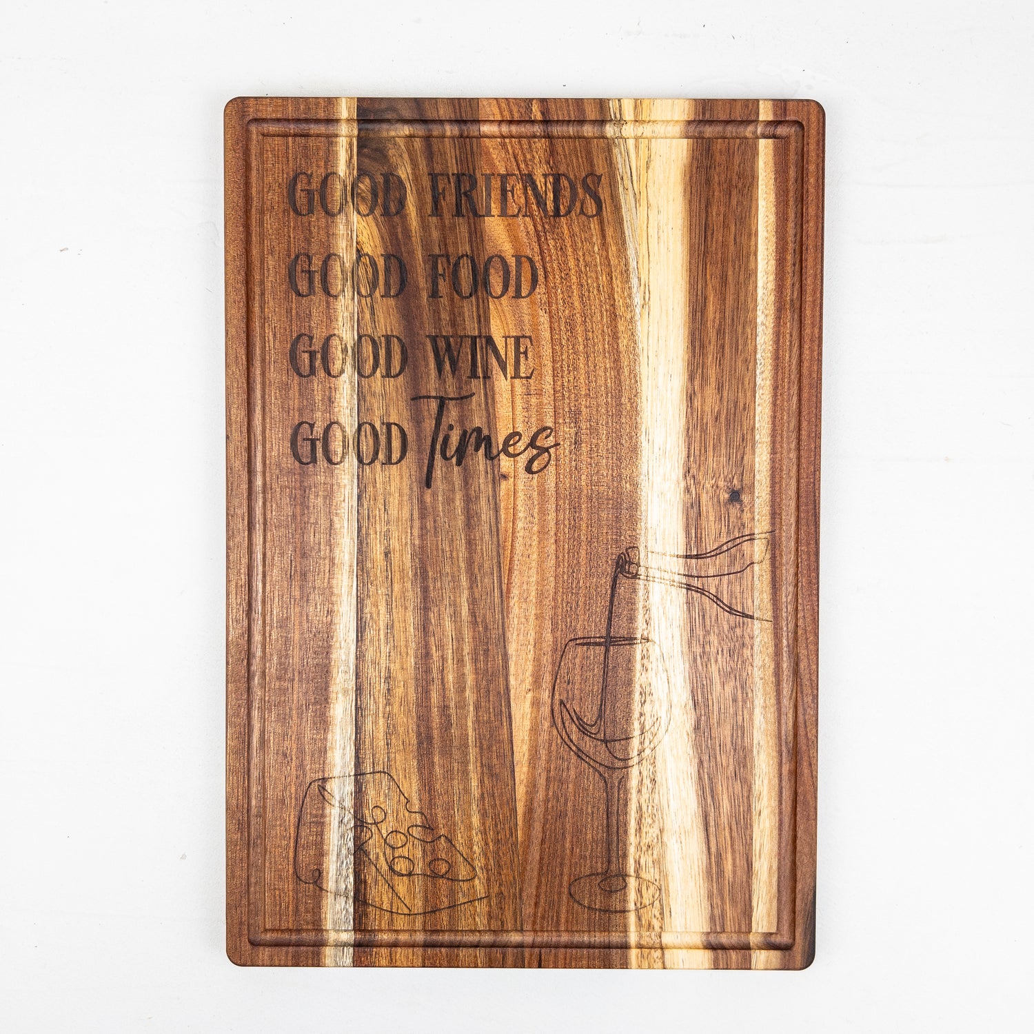 Wooden cutting board with engraved text and wine glass design on a white background