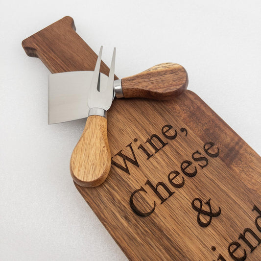 Wooden cutting board with engraved text and an acacia cheese knife set LUNA 