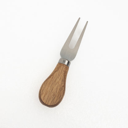 Cheese fork with an acacia handle and metal prongs on a white background
