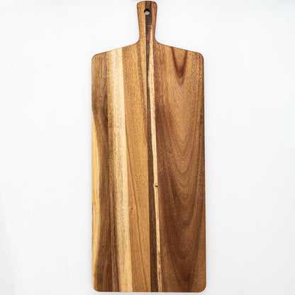 Large wooden tapas board with a handle on a white background