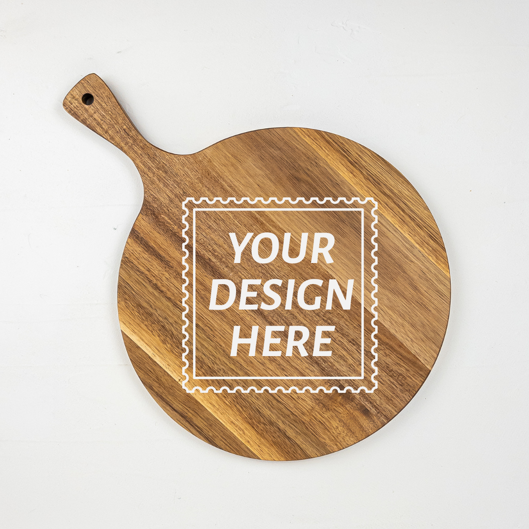 Personalizable acacia round wooden serving board with 'Your Design Here' text on a white background