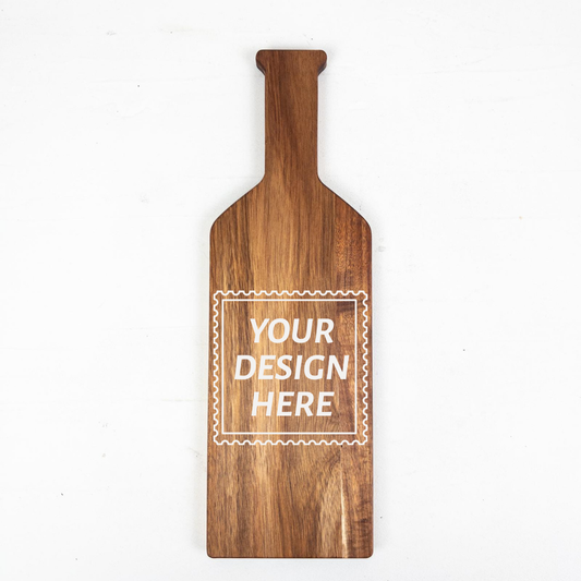 Personalizable acacia wooden bottle-shaped serving board with customizable text area on a white background