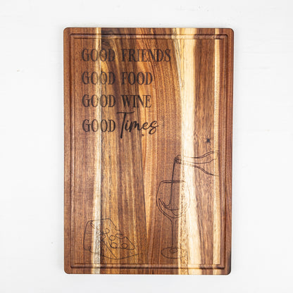 Wooden cutting board with engraved text and wine glass design on a white background