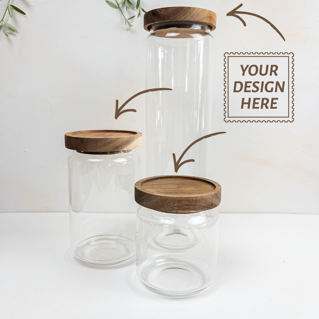 Three personalizable borosilicate glass jars with acacia wooden lids on a white background