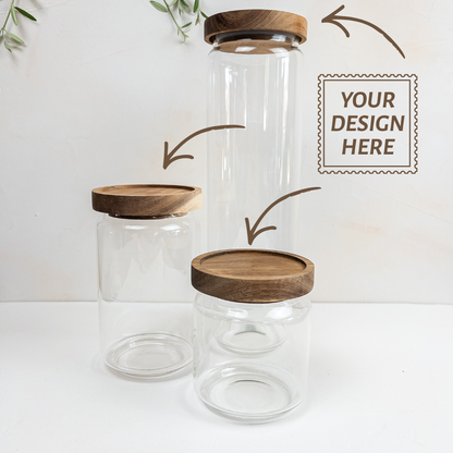 Three personalizable borosilicate glass jars with acacia wooden lids on a white background